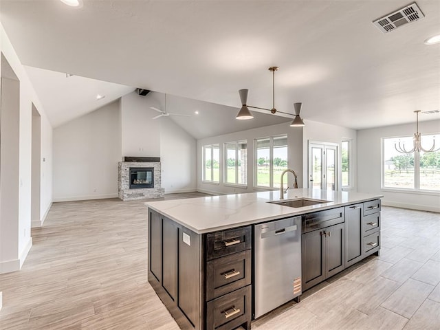 6881 Lake View Ct, Cashion, OK 73016 - kitchen with dishwasher, ceiling fan, a stone fireplace, healthy amount of natural light, and lofted ceiling