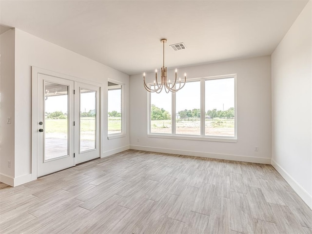 6881 Lake View Ct, Cashion, OK 73016 - unfurnished dining area with light wood-type flooring and a chandelier