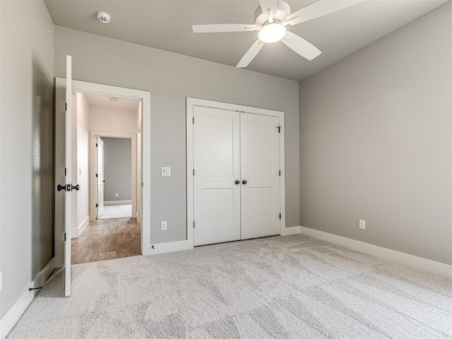 6881 Lake View Ct, Cashion, OK 73016 - unfurnished bedroom with carpet, a closet, and a ceiling fan