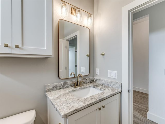 6881 Lake View Ct, Cashion, OK 73016 - bathroom featuring vanity and wood finished floors