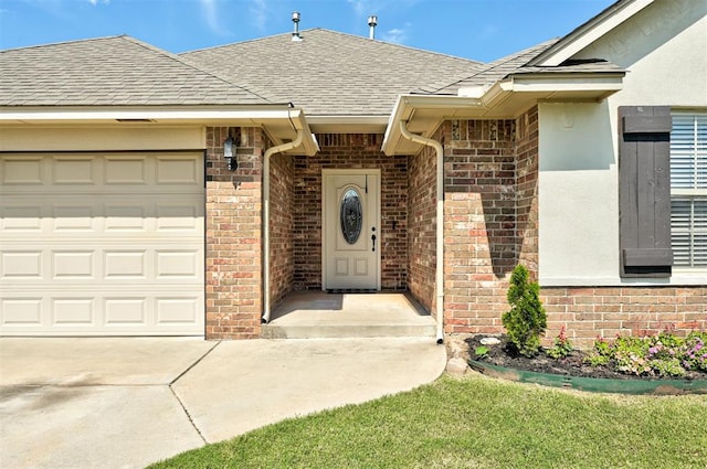 2305 Makaila Way, Yukon, OK 73099 - property entrance featuring roof with shingles, a garage, and brick siding