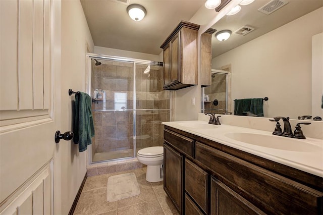 2305 Makaila Way, Yukon, OK 73099 - full bath with double vanity, a stall shower, and tile patterned floors
