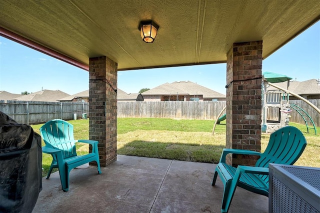 2305 Makaila Way, Yukon, OK 73099 - fenced backyard with a patio area, a playground, and area for grilling