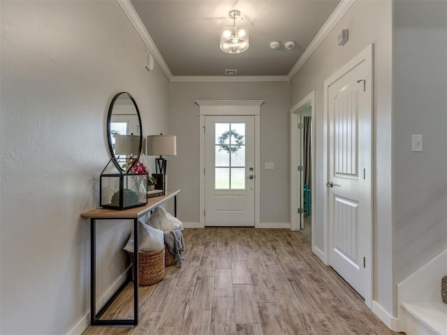 1391 Hickory Trl, Piedmont, OK 73078 - entrance foyer with light wood finished floors, a chandelier, and crown molding