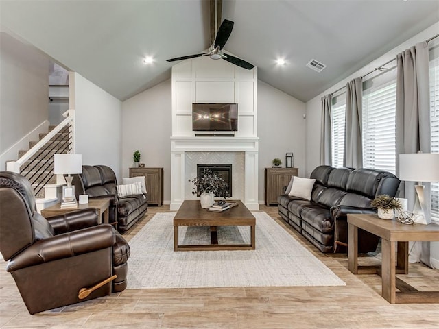 1391 Hickory Trl, Piedmont, OK 73078 - living room with a ceiling fan, stairs, light wood-type flooring, and a large fireplace