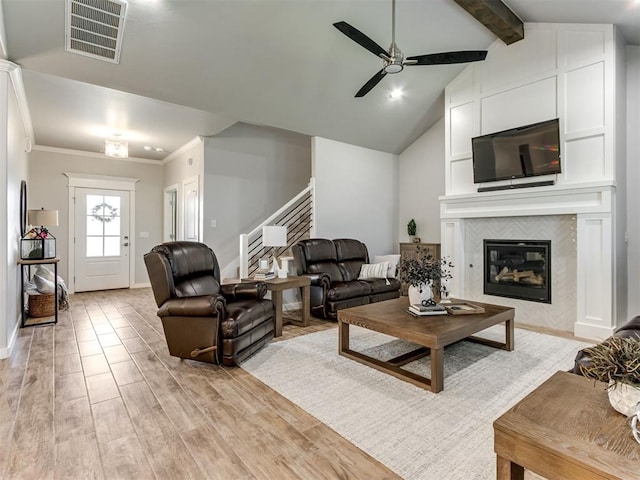 1391 Hickory Trl, Piedmont, OK 73078 - living area featuring ceiling fan, stairs, light wood finished floors, a fireplace, and ornamental molding