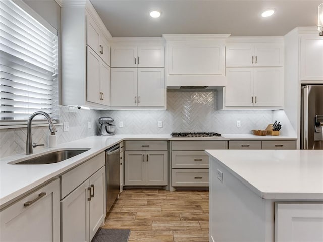 1391 Hickory Trl, Piedmont, OK 73078 - kitchen with appliances with stainless steel finishes, light countertops, plenty of natural light, light wood-style floors, and recessed lighting