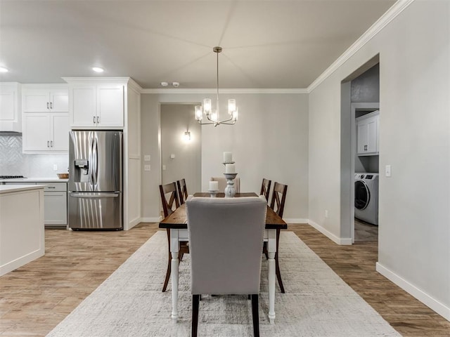 1391 Hickory Trl, Piedmont, OK 73078 - dining space with washer / clothes dryer, light wood-style floors, ornamental molding, a chandelier, and recessed lighting