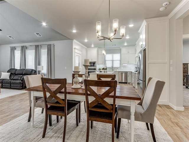 1391 Hickory Trl, Piedmont, OK 73078 - dining room featuring light wood finished floors, a chandelier, and recessed lighting