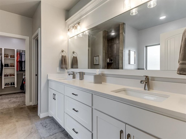 1391 Hickory Trl, Piedmont, OK 73078 - full bathroom with double vanity, a spacious closet, and tiled shower