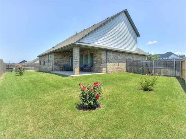 1391 Hickory Trl, Piedmont, OK 73078 - rear view of property with brick siding, a patio, and a fenced backyard