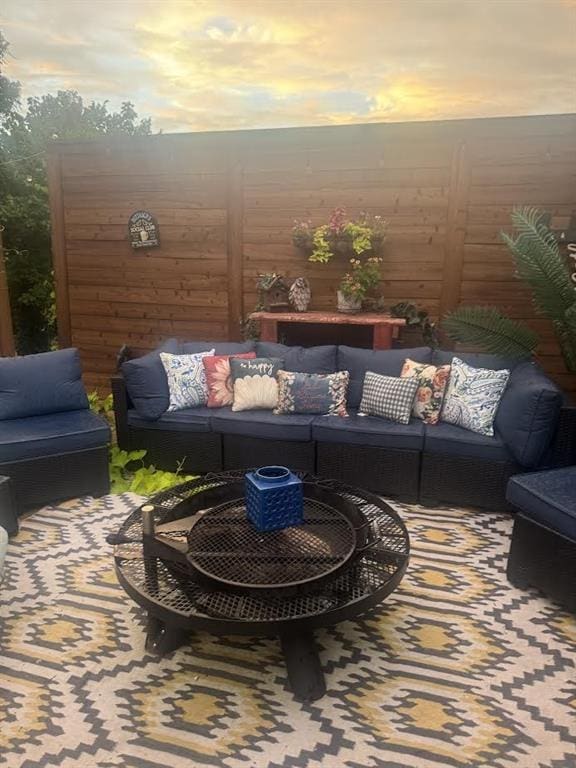 7013 Morning Song Dr, Oklahoma City, OK 73150 - balcony at dusk featuring outdoor lounge area and a patio