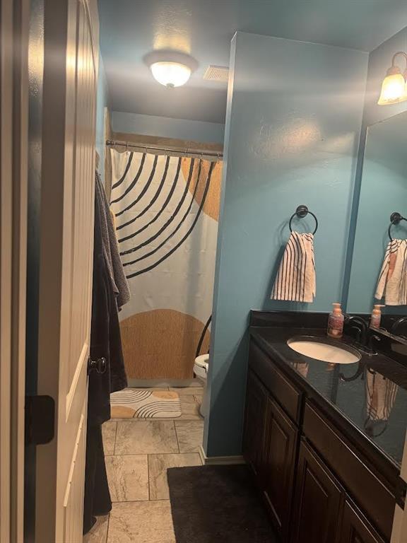 7013 Morning Song Dr, Oklahoma City, OK 73150 - full bathroom with vanity and a shower with shower curtain