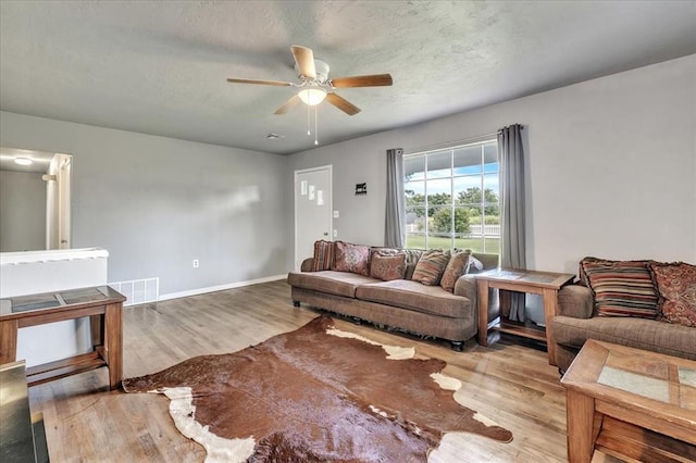 601 N Dobbs Rd, Harrah, OK 73045 - living area with ceiling fan and wood finished floors
