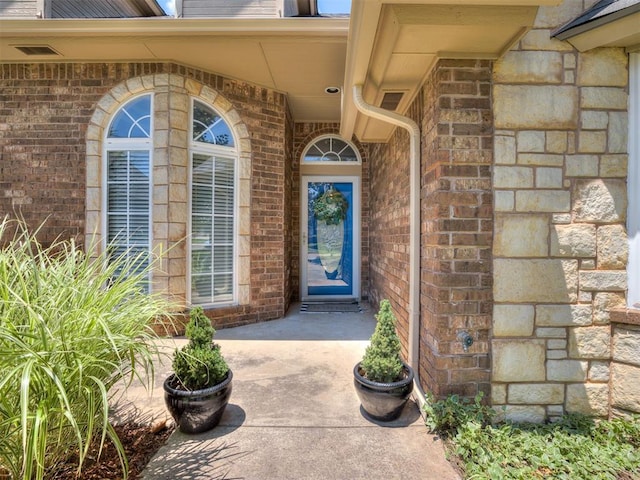 2009 Pembroke Ln, Edmond, OK 73003 - view of exterior entry with brick siding and stone siding