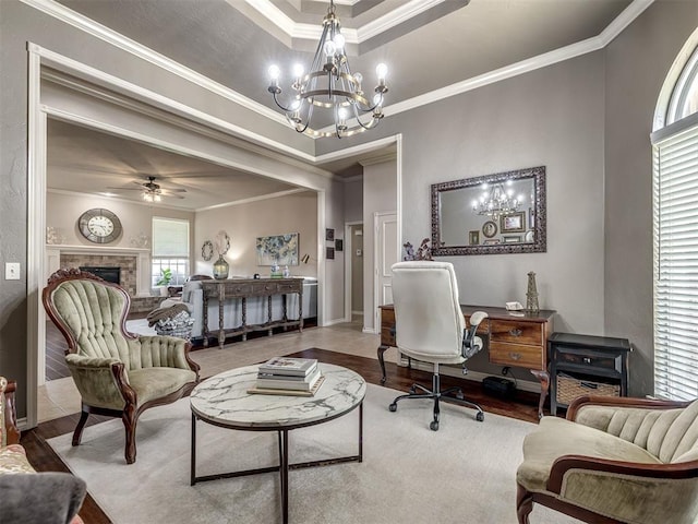 2009 Pembroke Ln, Edmond, OK 73003 - office area with a chandelier, wood finished floors, crown molding, a fireplace, and a tray ceiling