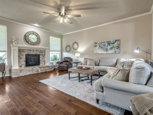2009 Pembroke Ln, Edmond, OK 73003 - living area featuring dark wood-style floors, ceiling fan, crown molding, and a fireplace