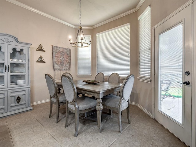 2009 Pembroke Ln, Edmond, OK 73003 - dining space featuring a chandelier, light tile patterned floors, and crown molding