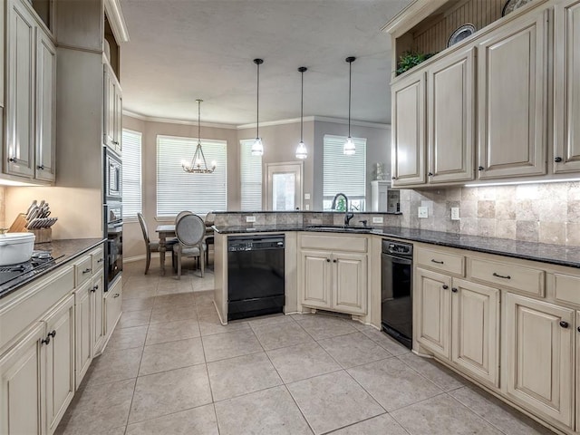 2009 Pembroke Ln, Edmond, OK 73003 - kitchen featuring appliances with stainless steel finishes, a chandelier, ornamental molding, a peninsula, and decorative backsplash