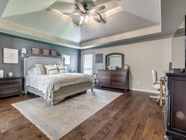 2009 Pembroke Ln, Edmond, OK 73003 - bedroom with a tray ceiling, dark wood finished floors, and ceiling fan