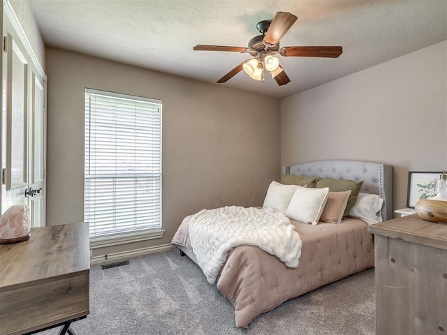 2009 Pembroke Ln, Edmond, OK 73003 - carpeted bedroom featuring multiple windows and ceiling fan