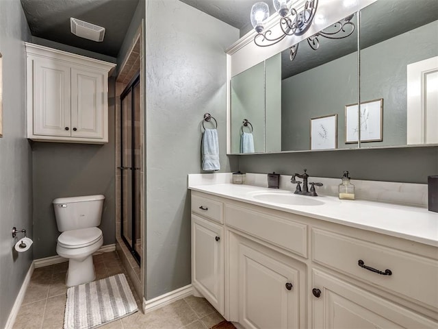 2009 Pembroke Ln, Edmond, OK 73003 - bathroom featuring vanity, a shower stall, and tile patterned flooring