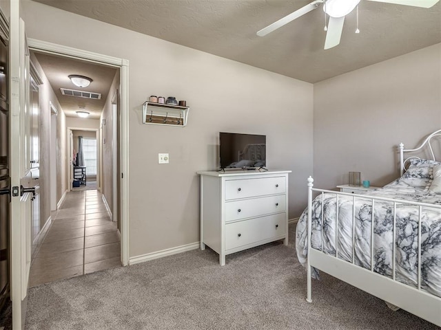 2009 Pembroke Ln, Edmond, OK 73003 - bedroom featuring light colored carpet and a ceiling fan