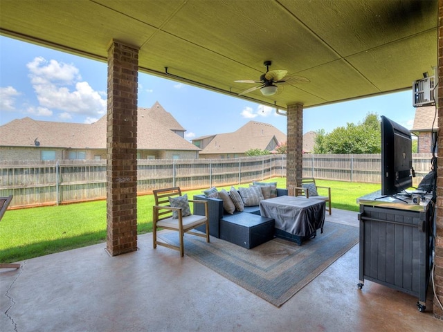 2009 Pembroke Ln, Edmond, OK 73003 - fenced backyard featuring outdoor lounge area, a patio, and ceiling fan