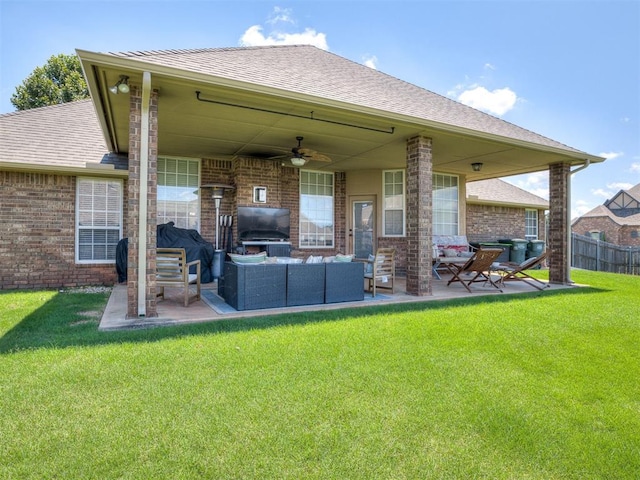 2009 Pembroke Ln, Edmond, OK 73003 - rear view of house featuring a ceiling fan, outdoor lounge area, a patio, brick siding, and a shingled roof