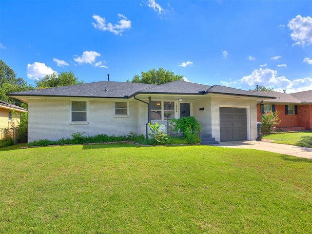 3804 NW 52nd St, Oklahoma City, OK 73112 - ranch-style home featuring a garage, brick siding, covered porch, and a front lawn