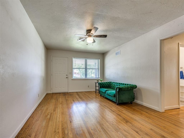 3804 NW 52nd St, Oklahoma City, OK 73112 - unfurnished room with light wood-type flooring, ceiling fan, and a textured ceiling