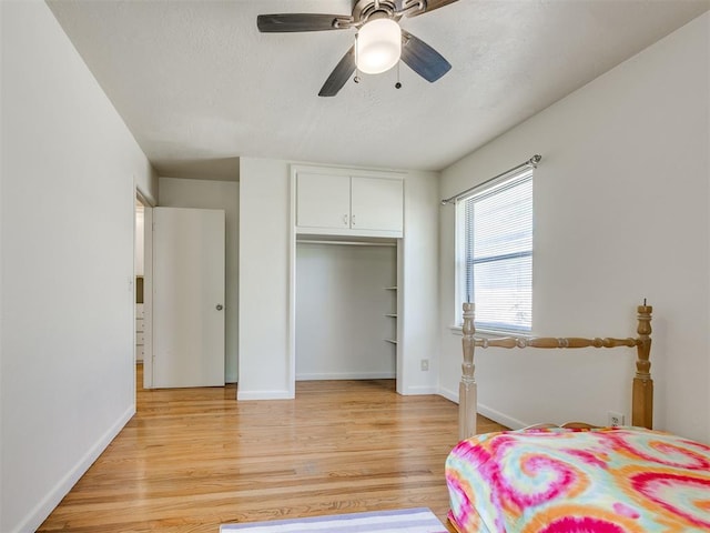 3804 NW 52nd St, Oklahoma City, OK 73112 - bedroom with light wood-type flooring, a closet, ceiling fan, and a textured ceiling