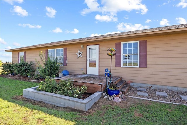 5097 County St Unit 2580, Hinton, OK 73047 - view of front facade featuring a front lawn and a wooden deck