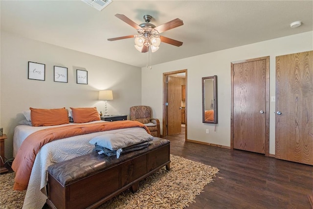 5097 County St Unit 2580, Hinton, OK 73047 - bedroom featuring wood finished floors, connected bathroom, multiple closets, and a ceiling fan