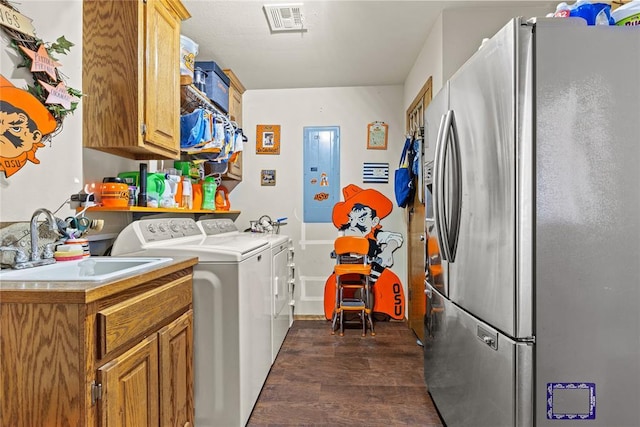 5097 County St Unit 2580, Hinton, OK 73047 - washroom featuring dark wood-style flooring, electric panel, and separate washer and dryer