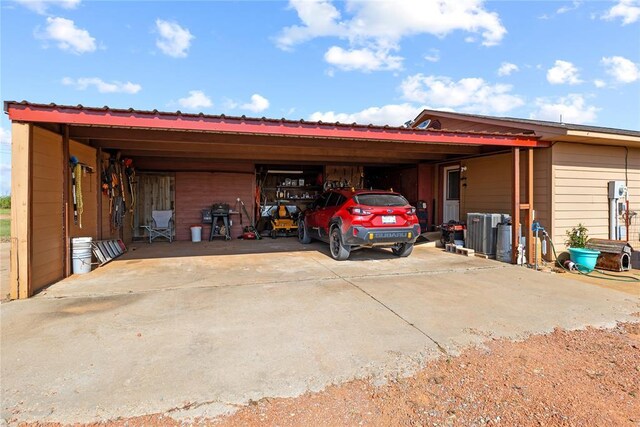 5097 County St Unit 2580, Hinton, OK 73047 - view of parking / parking lot with an attached carport and driveway