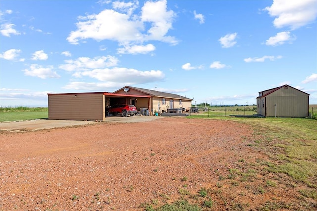 5097 County St Unit 2580, Hinton, OK 73047 - view of pole building with driveway and an attached carport