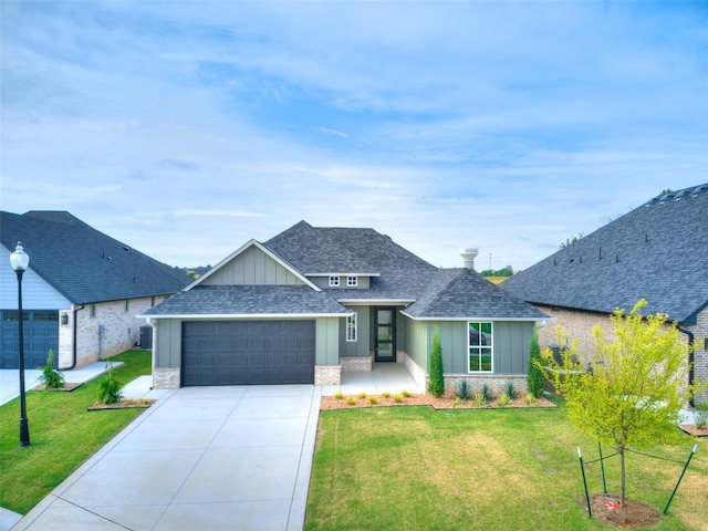 216 Pont Neuf Ct, Edmond, OK 73034 - view of front facade with a garage, roof with shingles, a front lawn, and driveway