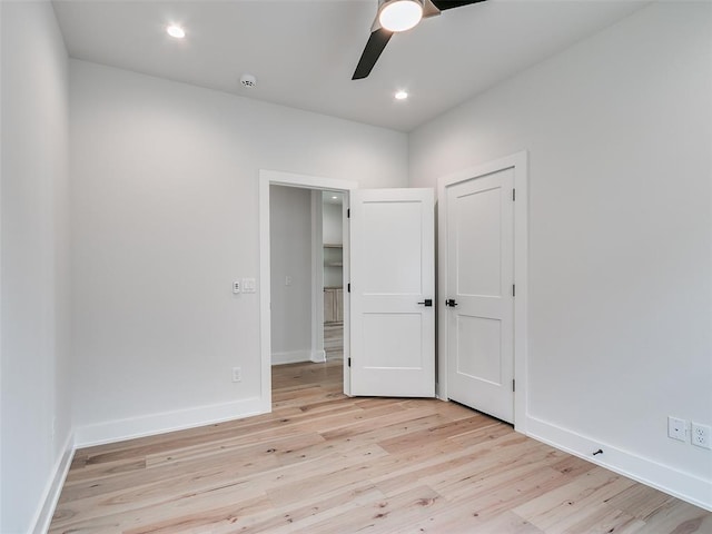 216 Pont Neuf Ct, Edmond, OK 73034 - unfurnished bedroom with light wood finished floors, ceiling fan, and recessed lighting