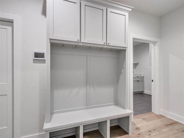 216 Pont Neuf Ct, Edmond, OK 73034 - mudroom with light wood-type flooring and baseboards
