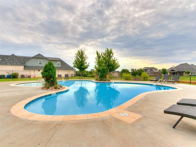 216 Pont Neuf Ct, Edmond, OK 73034 - community pool with a patio area