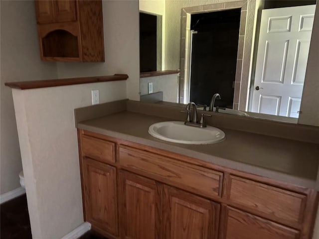 bathroom with vanity and an enclosed shower
