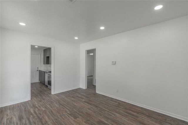 1120 SW 47th St, Oklahoma City, OK 73109 - spare room with dark wood-style flooring and recessed lighting