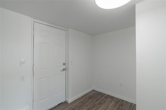 1120 SW 47th St, Oklahoma City, OK 73109 - spare room with dark wood-type flooring and baseboards