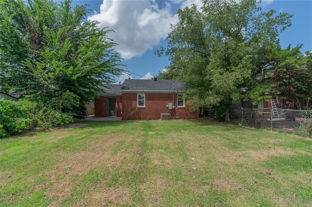 1120 SW 47th St, Oklahoma City, OK 73109 - rear view of property featuring brick siding