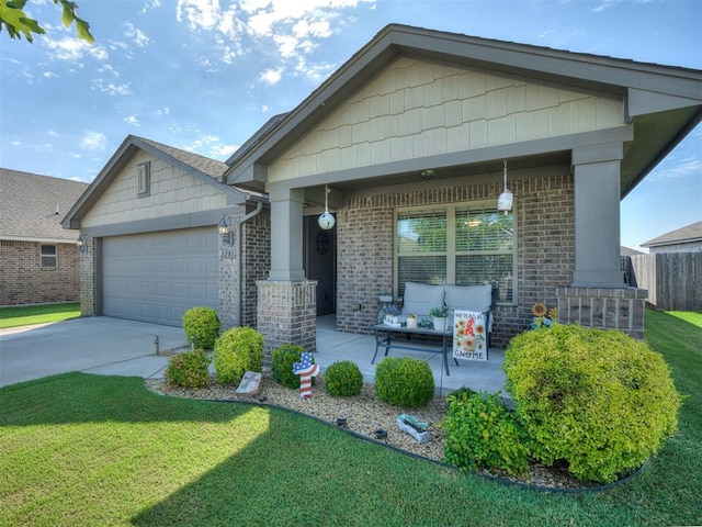 12812 Double V Dr, Piedmont, OK 73078 - view of front of home with an attached garage, brick siding, and concrete driveway