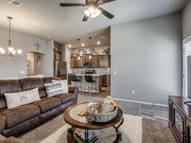 12812 Double V Dr, Piedmont, OK 73078 - living area with a chandelier and a ceiling fan