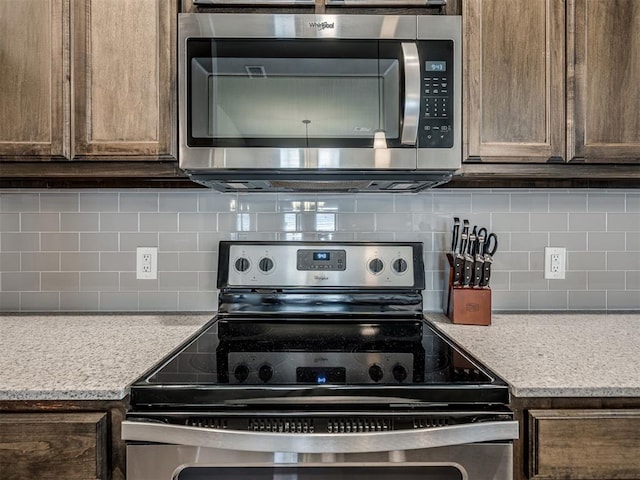 12812 Double V Dr, Piedmont, OK 73078 - kitchen featuring stainless steel appliances, tasteful backsplash, and light countertops