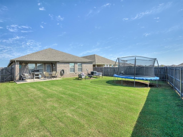 12812 Double V Dr, Piedmont, OK 73078 - fenced backyard with a trampoline and a patio