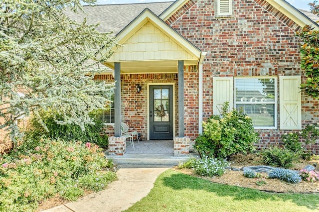 775 Magnolia Ln, Tuttle, OK 73089 - doorway to property featuring brick siding and a porch